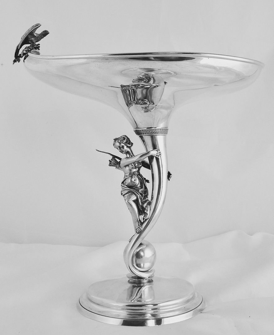 AN ARTISTICALLY PROGRESSIVE GORHAM STERLING SILVER FIGURAL FRUIT STAND